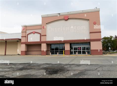 The faded outline of a logo sign outside of a closed Burlington Stores, Inc., retail store in ...