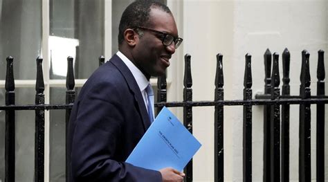 New UK finance minister slashes taxes and hopes growth will pay for it ...