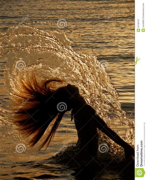 Girl Splashing The Sea Water Royalty Free Stock Photography - Image: 25196107