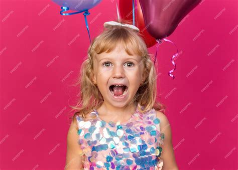 Free Photo | Excited little blonde girl standing with helium balloons ...