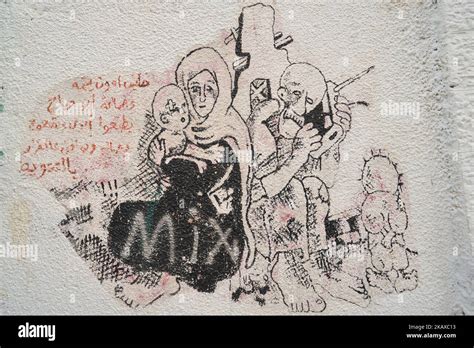 Political and social mural paintings and graffitis on the Israeli West ...