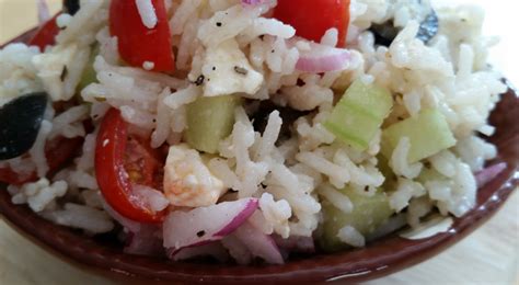 Healthy salad idea: Mediterranean rice salad with black olives, tomatoes, cucumber and feta ...