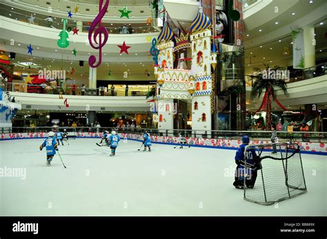 Children playing ice-hockey on the ice rink of the Al-Ain-Mall, Al Ain ...