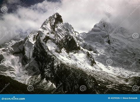 Jagged snow capped peaks stock photo. Image of glacier - 4229326