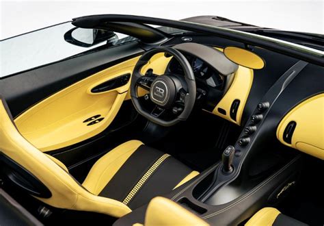 the interior of a yellow and black sports car