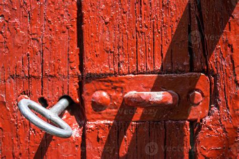 Antique iron key from the gate in the old red wooden gate. 13767613 ...