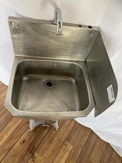 Used COMMERCIAL HAND WASH SINK WITH BACKSPLASH, BASE,AND FOOT PEDAL...