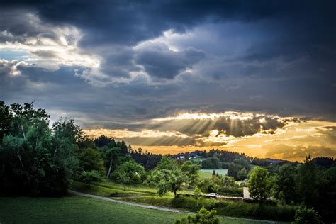 sun shines over a lush green mountainside, green mountain landscape 4k HD Wallpaper