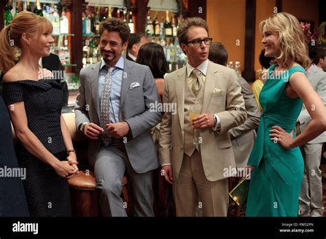 Left to right: Pepper Potts (Gwyneth Paltrow), Tony Stark (Robert ...