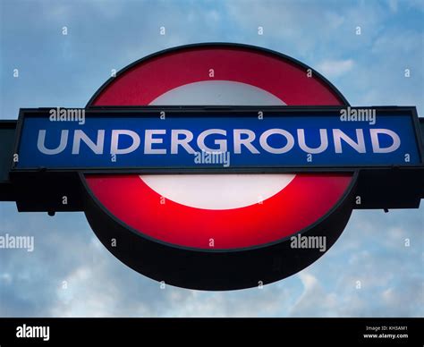 An underground tube station sign at dusk Stock Photo - Alamy