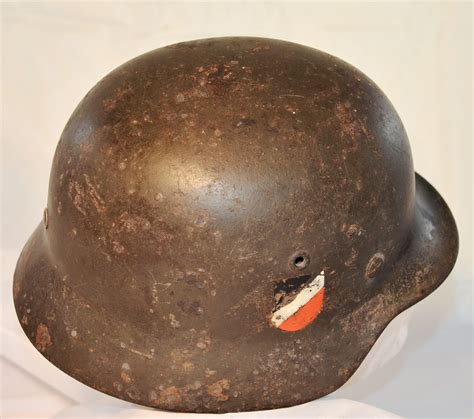 Second World War Six Types Of WW2 German Stahlhelm, Tin Helmets, Arranged On Ground Sheet Stock ...