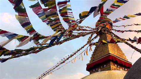 Tibetan Buddhist prayer flags waving at Boudhanath Stupa, Nepal - YouTube