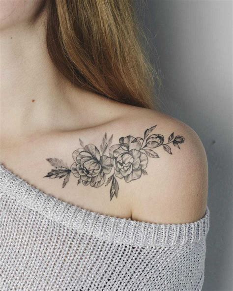 Floral tattoo on a collarbone - Tattoogrid.net