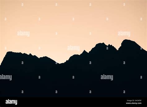 silhouette of mountain range during sunset Stock Photo - Alamy