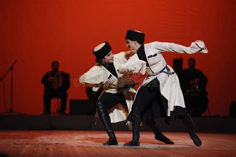 Dancer Performing Native Georgian Dance On Stage. Sukhishvili, The Georgian National Ballet ...