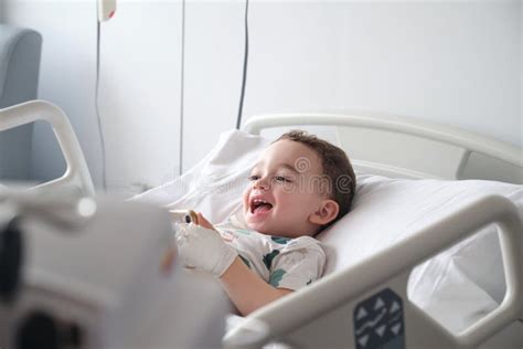 Child in Hospital Lying in Bed Stock Photo - Image of hospital, phone: 266479232