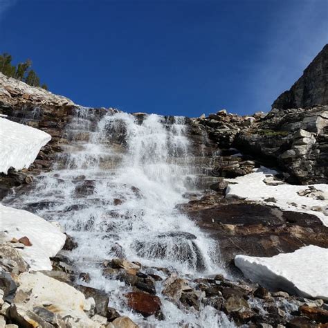 Snowmelt Runoff Over a Glacier Carved Waterfall Stock Photo - Image of ...