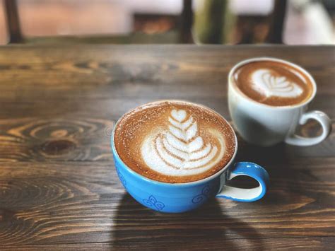 Piccolo Latte Art Coffee Cup and Cappuccino Cup on the Wooden Table ...