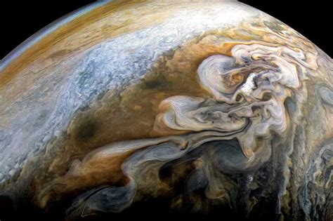 Stunning shot of Jupiter's swirling storms taken by Juno camera | New Scientist