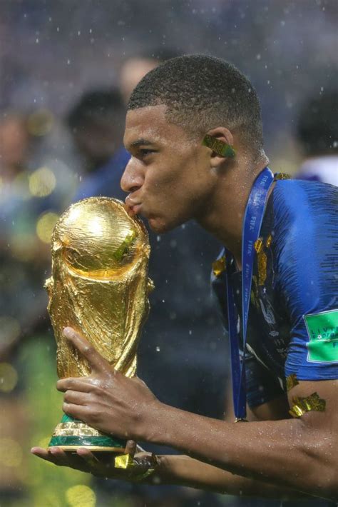 Kyliane Mbappe of France celebrates with the World Cup Trophy... in ...