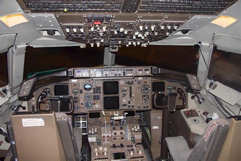 Commercial airplane cockpit Photograph by Gunter Nezhoda