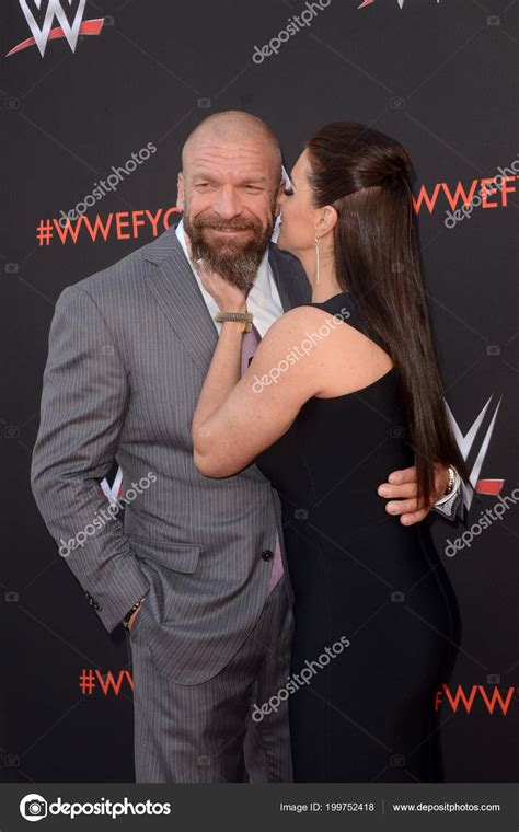 Triple H And Stephanie Mcmahon Kissing