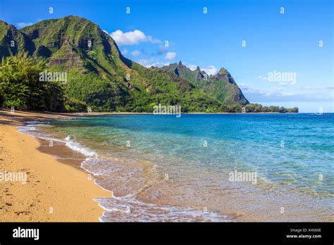 Sweeping view of beach in Haena, Kauai, with Tunnels Beach, Haena Beach Park and Mt. Makena ...