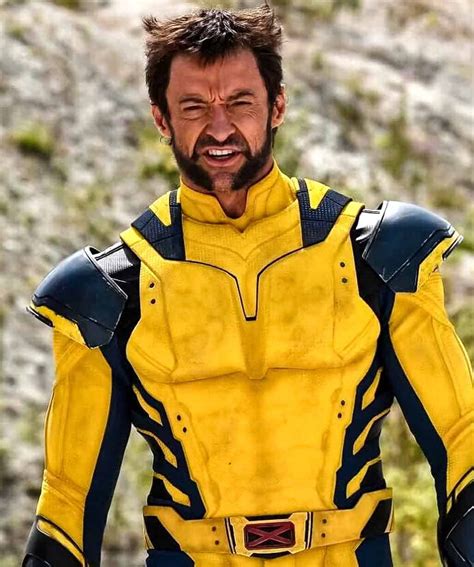 a man dressed in yellow and blue is smiling