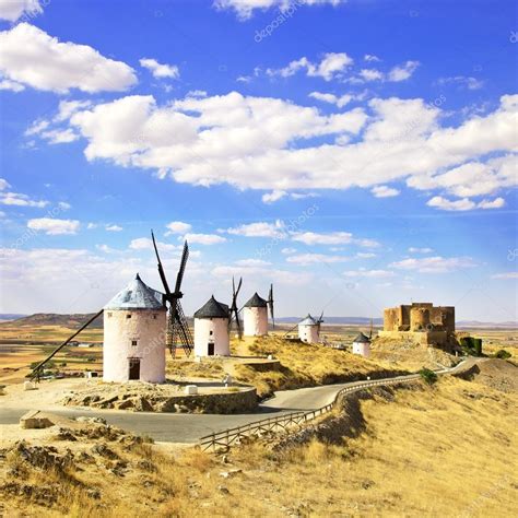 Windmills and castle of Consuegra. Spain — Stock Photo © StevanZZ #12431703