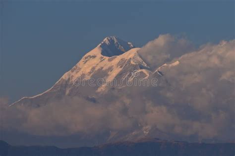 Snow Capped Trisul Mountain Behind the Clouds Glowing by Sun Light ...