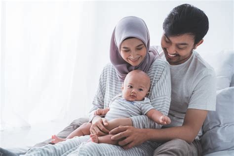 Premium Photo | Happy Muslim family with a cute baby