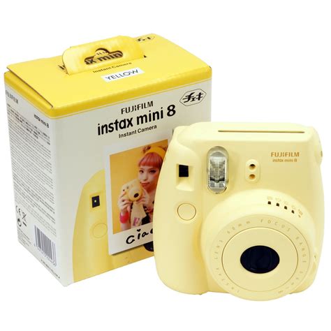 Yellow Polaroid Camera / The camera signals the recommended aperture setting with a flashing led ...