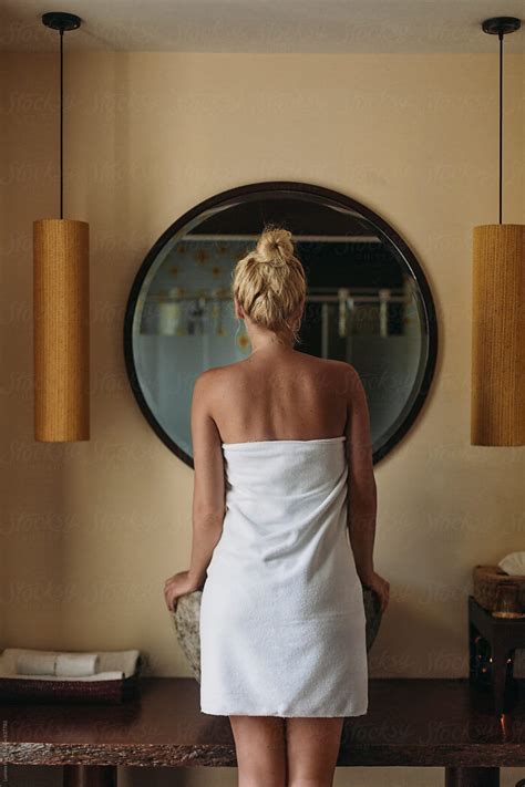 "Woman Standing In Front Of The Mirror In The Morning" by Stocksy Contributor "Lumina" - Stocksy