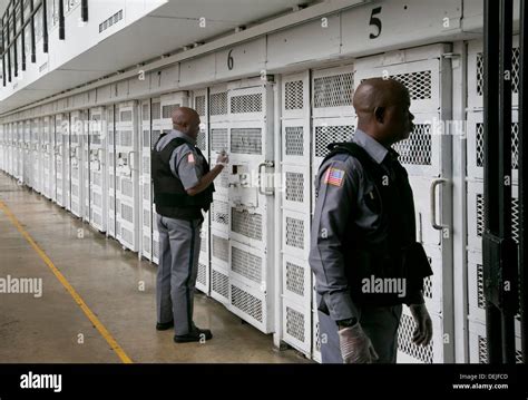 Prison guards inside prison unit near Houston, Texas walk through cells ...