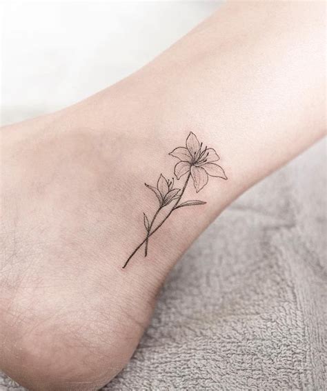 Lily Tattoo by Hongdam - Tattoo Insider