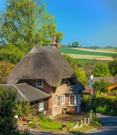 A pretty thatched cottage above the village of Pitton in Wiltshire. Credit Anguskirk | Thatched ...