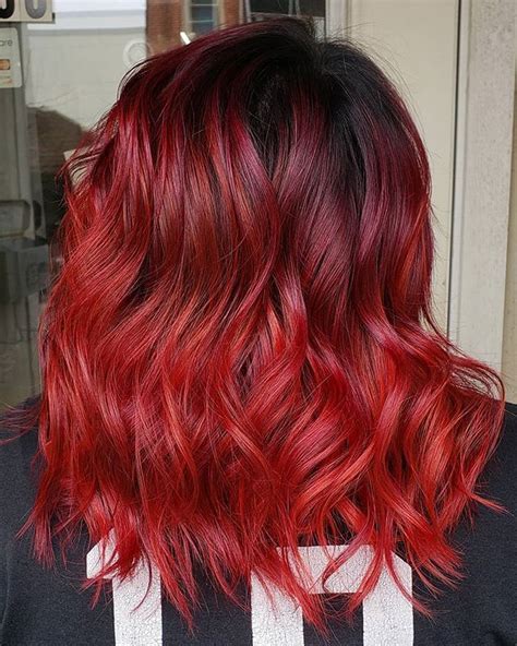 Bright neon red balayage ombre on dark red hair. Color by Ashton ...