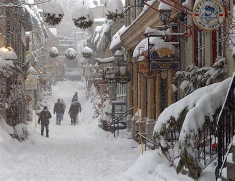 Winter scene in Quebec city (quartier Petit-Champlain) with heavy snow falling Quebec Canada ...