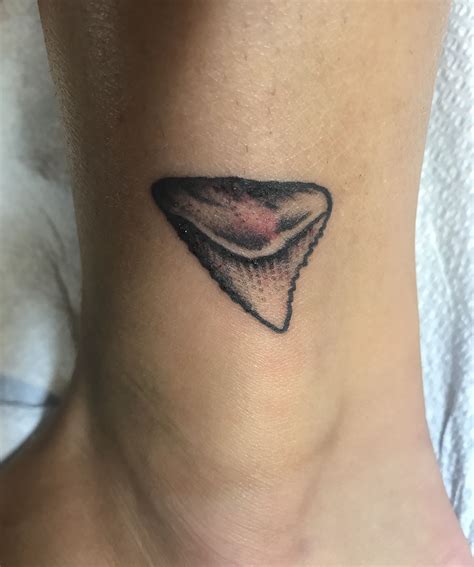 My shark tooth tattoo | Tooth tattoo, Tattoos, Shark tooth tattoo