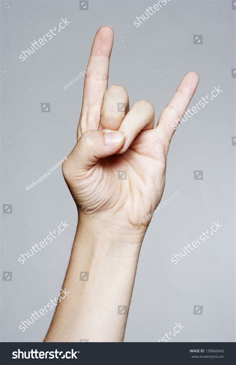 Hand Giving Devil Horns Gesture Stock Photo 139666942 - Shutterstock