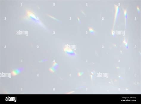 Blurred rainbow light refraction texture on white wall Stock Photo - Alamy