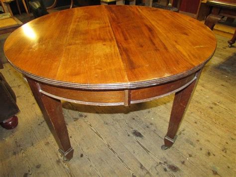 Antique round dining table on original castors | in Wells, Somerset | Gumtree