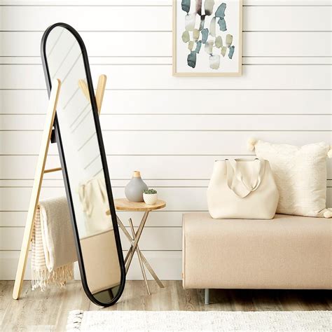 A full-length floor mirror that helps organize accessories? Yes please ...