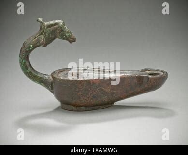 A Roman bronze oil lamp, in the shape of a moor's head, 1st/2nd Stock ...