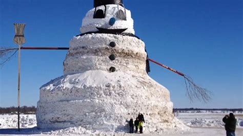 Man builds giant 50-foot-tall snowman with entire trees for arms ...