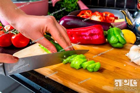 Female hand cut onion rustic kitchen table, Stock Photo, Picture And ...