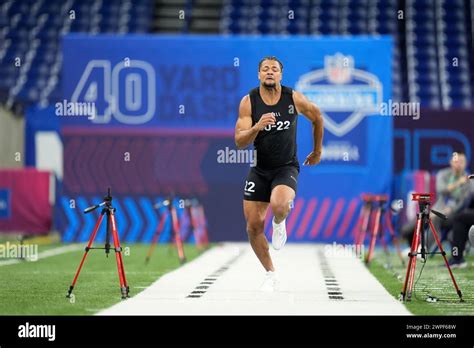 Washington wide receiver Rome Odunze runs a drill at the NFL football scouting combine, Saturday ...