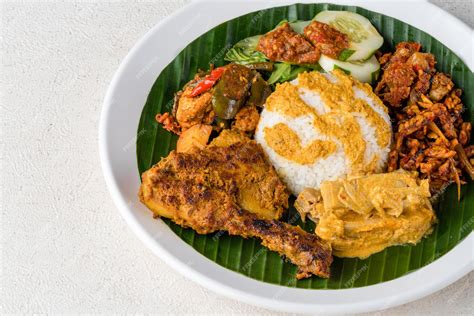 Premium Photo | Nasi padang with chicken rendang is an indonesian food ...