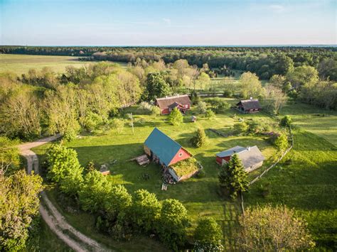 SAXBY, ESTONIA – 2016-05-29 : Aerial view of few houses in countryside ...