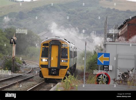 Aberystwyth railway station with the cambrian coast train appproaching ...